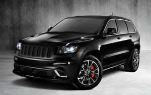 Majestic Jeep Grand Cherokee In Wilderness Wallpaper