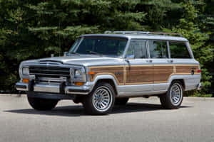 Majestic Jeep Wagoneer In Natural Setting Wallpaper