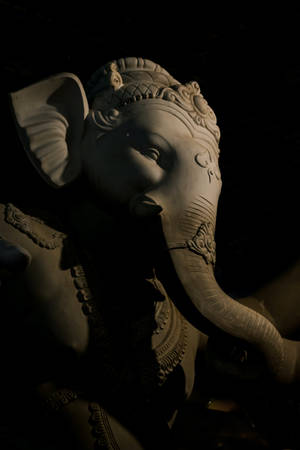 Majestic Lalbaugcha Raja On A Black Background Wallpaper