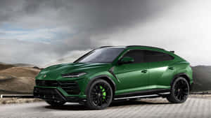 Majestic Lamborghini Urus On The Open Road Wallpaper