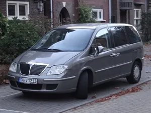 Majestic Lancia Phedra In Stunning Scenery Wallpaper