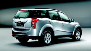 Majestic Mahindra Xuv500 Amidst The Cityscape Wallpaper