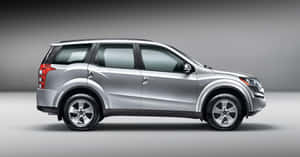 Majestic Mahindra Xuv500 Gliding Down The Highway Wallpaper