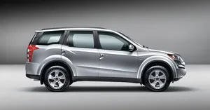 Majestic Mahindra Xuv500 Gliding Down The Highway Wallpaper