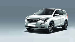 Majestic Mahindra Xuv500 In Natural Backdrop Wallpaper