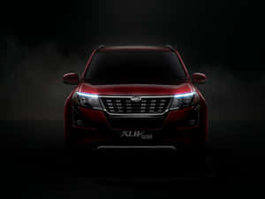 Majestic Mahindra Xuv500 In Natural Surroundings Wallpaper