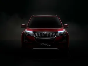Majestic Mahindra Xuv500 In Natural Surroundings Wallpaper