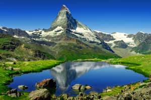 Majestic Matterhorn Reflection On The Serene Alpine Lake Wallpaper