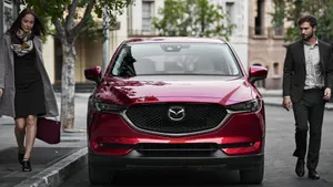 Majestic Mazda Cx-5 Cruising On A Breathtaking Road Wallpaper