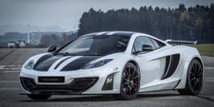 Majestic Mclaren Mp4-12c Parked On Open Street Wallpaper