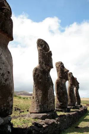 Majestic Moai Statues Under The Clear Sky Wallpaper