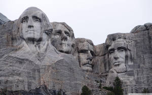 Majestic Mount Rushmore Under The Blue Sky Wallpaper