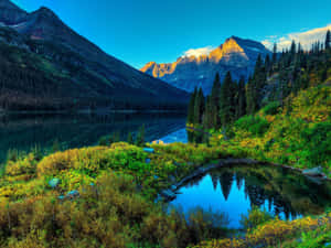 Majestic Mountain Peak Towering Over A Tranquil Valley Wallpaper