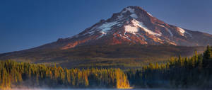 Majestic Mountain View Along An Idyllic Countryside Road Wallpaper