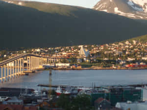 Majestic Night View Of Tromsø, Norway Wallpaper