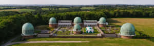 Majestic Observatory Under A Starry Night Sky Wallpaper