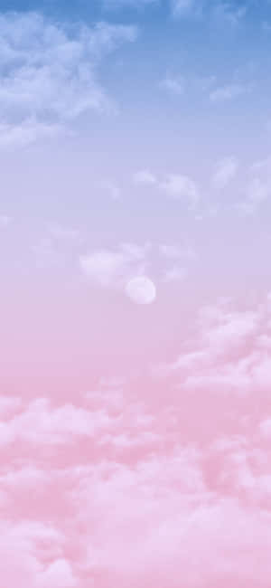 Majestic Pink And Blue Clouds As The Sun Sets Wallpaper