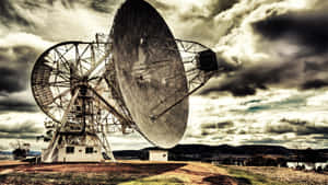 Majestic Radio Telescope Against The Starry Night Sky Wallpaper