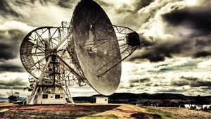Majestic Radio Telescope Against The Starry Night Sky Wallpaper