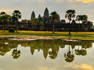 Majestic Reflection Of Angkor Thom In Water Wallpaper