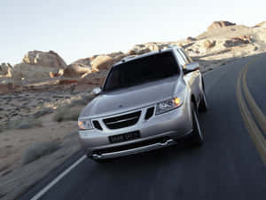 Majestic Saab 9-7x Parked Outdoors Wallpaper