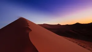 Majestic Sand Dunes In Sunset Light Wallpaper