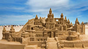 Majestic Sandcastle On A Sunny Beach Wallpaper