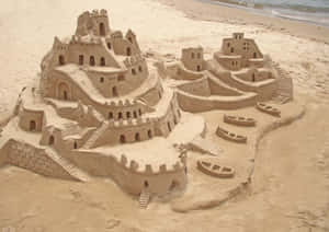 Majestic Sandcastle On A Sunny Beach Wallpaper