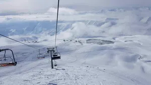 Majestic Ski Resort Surrounded By Snow-capped Mountains Wallpaper