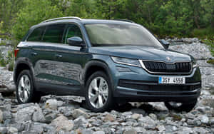 Majestic Skoda Kodiaq Cruising On A Highway Wallpaper