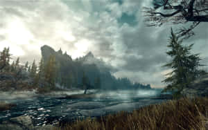 Majestic Skyrim Landscape With Mountainous Background Wallpaper