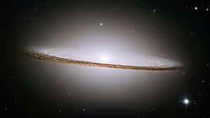 Majestic Spiral Galaxy In The Vast Universe Wallpaper