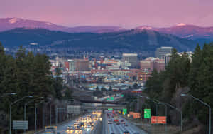 Majestic Spokane River And Downtown Spokane At Dusk Wallpaper