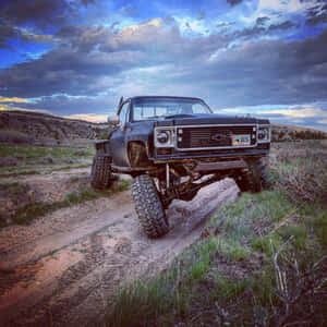 Majestic Square Body Truck Against A Mountainous Landscape Wallpaper