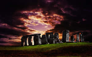 Majestic Stonehenge Under Ominous Clouds Wallpaper