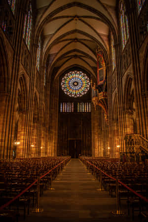 Majestic Strasbourg Cathedral Against Blue Sky Wallpaper
