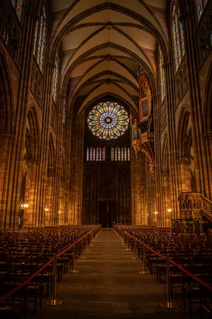Majestic Strasbourg Cathedral Against Blue Sky Wallpaper