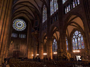 Majestic Strasbourg Cathedral Against Serene Sky Wallpaper