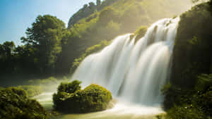 Majestic_ Sunlit_ Waterfall_4 K_ Ultra_ Wide.jpg Wallpaper