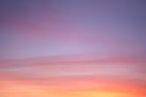 Majestic Sunset Over Mountainous Landscape Wallpaper