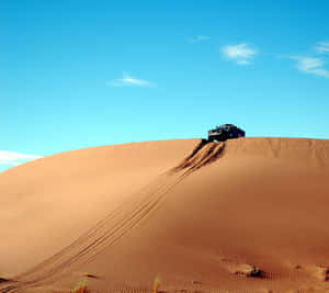 Majestic Sunset Over Sand Dunes Wallpaper