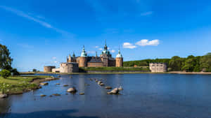 Majestic Sunset Over The Kalmar Castle In Sweden Wallpaper