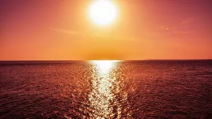 Majestic Sunset Reflection On A Calm Lake Wallpaper