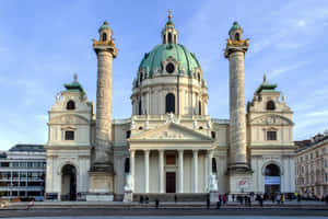 Majestic Vienna Cathedral Against Brilliant Sky Wallpaper