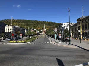 Majestic View Of Drammen City Under The Stunning Northern Lights Wallpaper