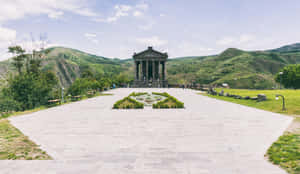 Majestic View Of Garni Temple With Scenic Walkway Wallpaper