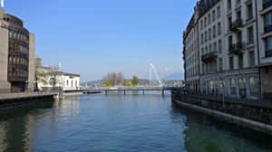 Majestic View Of Lake Geneva And The Beautiful City Of Switzerland Wallpaper