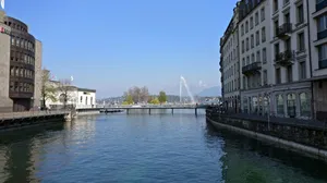 Majestic View Of Lake Geneva And The Beautiful City Of Switzerland Wallpaper