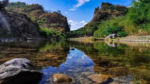Majestic View Of Mountains Against Crisp Blue Sky Wallpaper