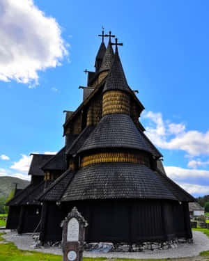 Majestic View Of Newly Tarred Heddal Stave Church Wallpaper